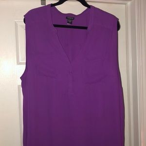 Sleeveless magenta colored chiffon blouse.